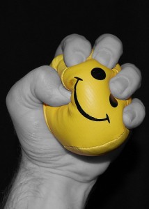 Hand clenching a Stress Relief Ball